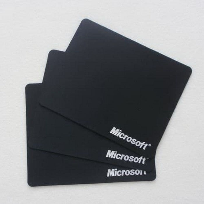Three black Microsoft Nylon Game Mouse Pads with the Microsoft logo visible on each.